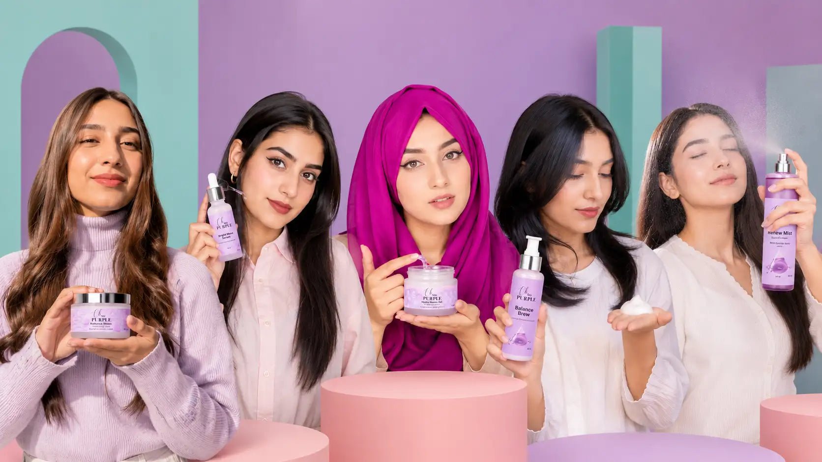 Five women posing together in a studio setting, each holding a purple and white cosmetic product from the brand L'Oréal Paris. The women are dressed in light-colored tops, and the background features pastel purple and teal geometric shapes.